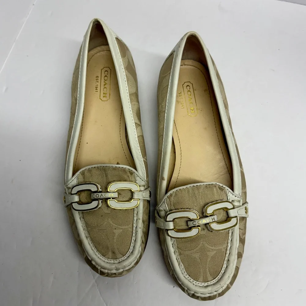 Coach Ella loafers in a gold and white signature monogram canvas. Size 6.5